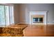 Bright living room with fireplace and view to kitchen at 4129 Lansfaire Ter, Suwanee, GA 30024