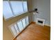 Lofted living room with fireplace, high ceilings, and large windows at 4129 Lansfaire Ter, Suwanee, GA 30024