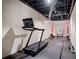 Home gym featuring a treadmill and baseball equipment, perfect for fitness and sports enthusiasts at 5292 Candleberry Sw Dr, Lilburn, GA 30047