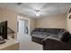 Finished basement with a cozy seating area and adjacent office space for versatile use at 5292 Candleberry Sw Dr, Lilburn, GA 30047