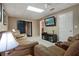 Spacious basement lounge with comfortable seating, entertainment center, and recessed lighting at 5292 Candleberry Sw Dr, Lilburn, GA 30047