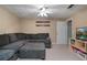 Finished basement with sectional sofa, TV, and space for leisure, and entertainment at 5292 Candleberry Sw Dr, Lilburn, GA 30047