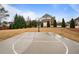 Backyard basketball court providing ample space for recreational play and Gathering fun at 5292 Candleberry Sw Dr, Lilburn, GA 30047
