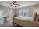 Bedroom with lots of light, view from window, desk, and ceiling fan at 5292 Candleberry Sw Dr, Lilburn, GA 30047