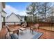 Outdoor deck featuring wicker furniture and space for grilling, ideal for outdoor gatherings at 5292 Candleberry Sw Dr, Lilburn, GA 30047