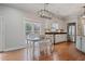 Charming kitchen with stainless steel appliances and adjacent dining area at 5292 Candleberry Sw Dr, Lilburn, GA 30047
