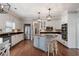 Spacious kitchen with stainless steel appliances and island with bar stool seating at 5292 Candleberry Sw Dr, Lilburn, GA 30047
