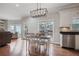 Open kitchen and living area featuring stainless steel appliances and hardwood floors at 5292 Candleberry Sw Dr, Lilburn, GA 30047
