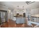 Spacious kitchen with stainless steel appliances and kitchen island at 5292 Candleberry Sw Dr, Lilburn, GA 30047