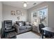 Cozy sitting room with large window, comfortable seating, and a homey decorative touch at 5292 Candleberry Sw Dr, Lilburn, GA 30047