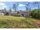 Spacious backyard featuring a patio with seating, and a large grassy area at 5403 Woodberry Cir, Marietta, GA 30068