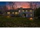 Backyard with a firepit, chairs and the rear elevation of a home at sunset at 5403 Woodberry Cir, Marietta, GA 30068