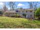 Backyard with a firepit, chairs and the rear elevation of a home at 5403 Woodberry Cir, Marietta, GA 30068