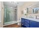 Modern bathroom with a glass-enclosed shower, vanity, and stylish fixtures at 5403 Woodberry Cir, Marietta, GA 30068