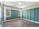 Bedroom with hardwood floors, wall panels and natural light at 5403 Woodberry Cir, Marietta, GA 30068