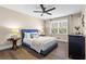 Comfortable bedroom with a fan, plush bedding, and lots of natural light at 5403 Woodberry Cir, Marietta, GA 30068