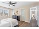 Spacious bedroom with a ceiling fan, window, and view of backyard at 5403 Woodberry Cir, Marietta, GA 30068