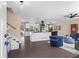 Bright open-concept living space with kitchen featuring modern finishes and a seamless flow to the dining and living area at 5403 Woodberry Cir, Marietta, GA 30068