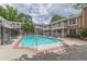 Relaxing community pool with lounge chairs in a fenced area at 885 Briarcliff Ne Rd # D3, Atlanta, GA 30306