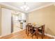 Cozy dining area showcasing seamless connectivity to the kitchen with wood flooring at 885 Briarcliff Ne Rd # D3, Atlanta, GA 30306