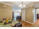 Cozy dining area featuring wood floors, a stylish light fixture, and seamless flow into the living room at 885 Briarcliff Ne Rd # D3, Atlanta, GA 30306
