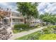 Beautiful complex with brick exterior, white railings, and landscaped grounds at 885 Briarcliff Ne Rd # D3, Atlanta, GA 30306