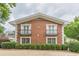 Charming brick building with decorative balconies and manicured landscaping at 885 Briarcliff Ne Rd # D3, Atlanta, GA 30306
