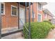 Inviting brick exterior with a small stoop and black railing, surrounded by green bushes at 885 Briarcliff Ne Rd # D3, Atlanta, GA 30306