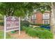 A view of the Highland Hall building with well-maintained landscaping and clear signage at 885 Briarcliff Ne Rd # D3, Atlanta, GA 30306