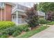 A manicured lawn and walkway alongside a brick building with white balconies at 885 Briarcliff Ne Rd # D3, Atlanta, GA 30306