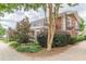 Charming brick building with upper balconies, complemented by lush shrubbery and a serene walkway at 885 Briarcliff Ne Rd # D3, Atlanta, GA 30306