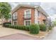 Exterior of a brick apartment building with landscaped grounds and an outdoor staircase at 885 Briarcliff Ne Rd # D3, Atlanta, GA 30306