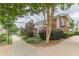 Elegant brick building with balcony, surrounded by manicured landscaping and a paved walkway at 885 Briarcliff Ne Rd # D3, Atlanta, GA 30306