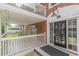 Inviting front entrance with brick facade, private porch, and black framed windows and door, with a modern light fixture at 885 Briarcliff Ne Rd # D3, Atlanta, GA 30306