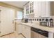 Bright kitchen with white cabinets, stainless steel appliances, and tile flooring at 885 Briarcliff Ne Rd # D3, Atlanta, GA 30306