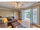 Comfortable living room with hardwood floors, ceiling fan, and access to the patio at 885 Briarcliff Ne Rd # D3, Atlanta, GA 30306
