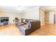 Inviting living room featuring a large leather sofa, hardwood floors, and a ceiling fan at 885 Briarcliff Ne Rd # D3, Atlanta, GA 30306