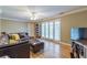 Bright living room with hardwood floors, ceiling fan, and french doors at 885 Briarcliff Ne Rd # D3, Atlanta, GA 30306