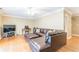 Spacious living room featuring a leather sectional sofa, hardwood floors, and natural light at 885 Briarcliff Ne Rd # D3, Atlanta, GA 30306