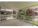 Covered outdoor patio with tiled floor and decorative white railing at 885 Briarcliff Ne Rd # D3, Atlanta, GA 30306