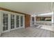 Spacious covered patio showcasing tiled flooring and access to lush outdoor area at 885 Briarcliff Ne Rd # D3, Atlanta, GA 30306