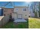 A view of the home's backyard featuring a fenced in yard, a concrete patio and green grass at 2102 Lenoa Ln, Austell, GA 30106