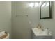Bathroom featuring a grey vanity, large mirror, towel bar, and tiled floors at 2102 Lenoa Ln, Austell, GA 30106