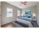 Bedroom featuring wood floors, neutral walls, and bright windows at 2102 Lenoa Ln, Austell, GA 30106