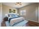 Cozy bedroom with ceiling fan and plush blue rug at 2102 Lenoa Ln, Austell, GA 30106