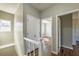 Upstairs hallway with natural light featuring access to bedrooms and bath at 2102 Lenoa Ln, Austell, GA 30106