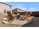 Backyard features a fire pit area with Adirondack chairs, ideal for outdoor entertaining and relaxation at 2286 Cadenza Cir, Dacula, GA 30019