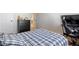 Bedroom featuring a bed, desk, dresser, and ensuite bathroom at 2286 Cadenza Cir, Dacula, GA 30019