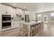 Modern kitchen with stainless steel appliances, spacious island, and stylish bar stool seating at 2286 Cadenza Cir, Dacula, GA 30019