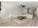Spacious living room with two couches, an area rug, and access to the foyer at 2286 Cadenza Cir, Dacula, GA 30019